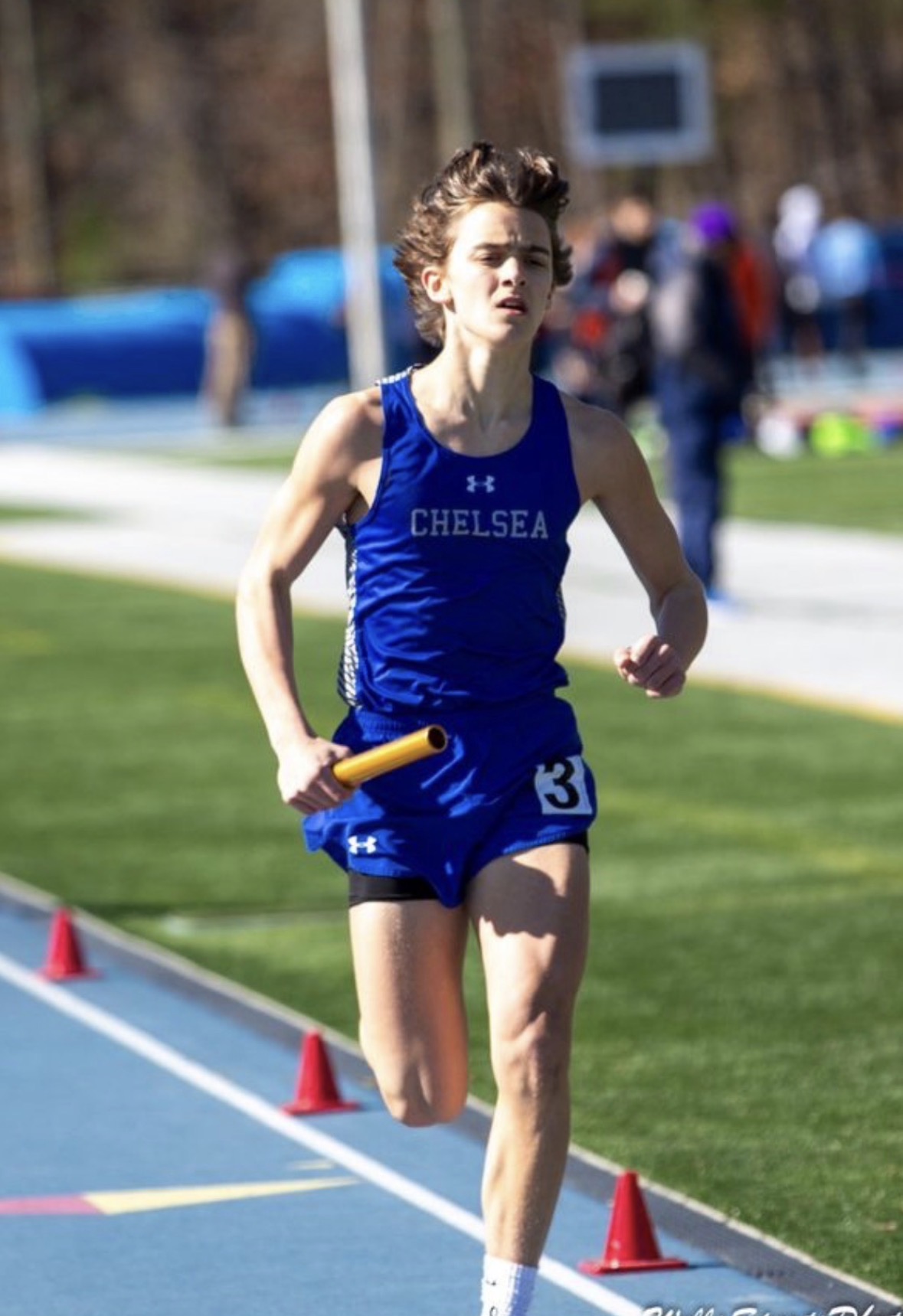 Joseph McGaha racing in a Chelsea High School singlet